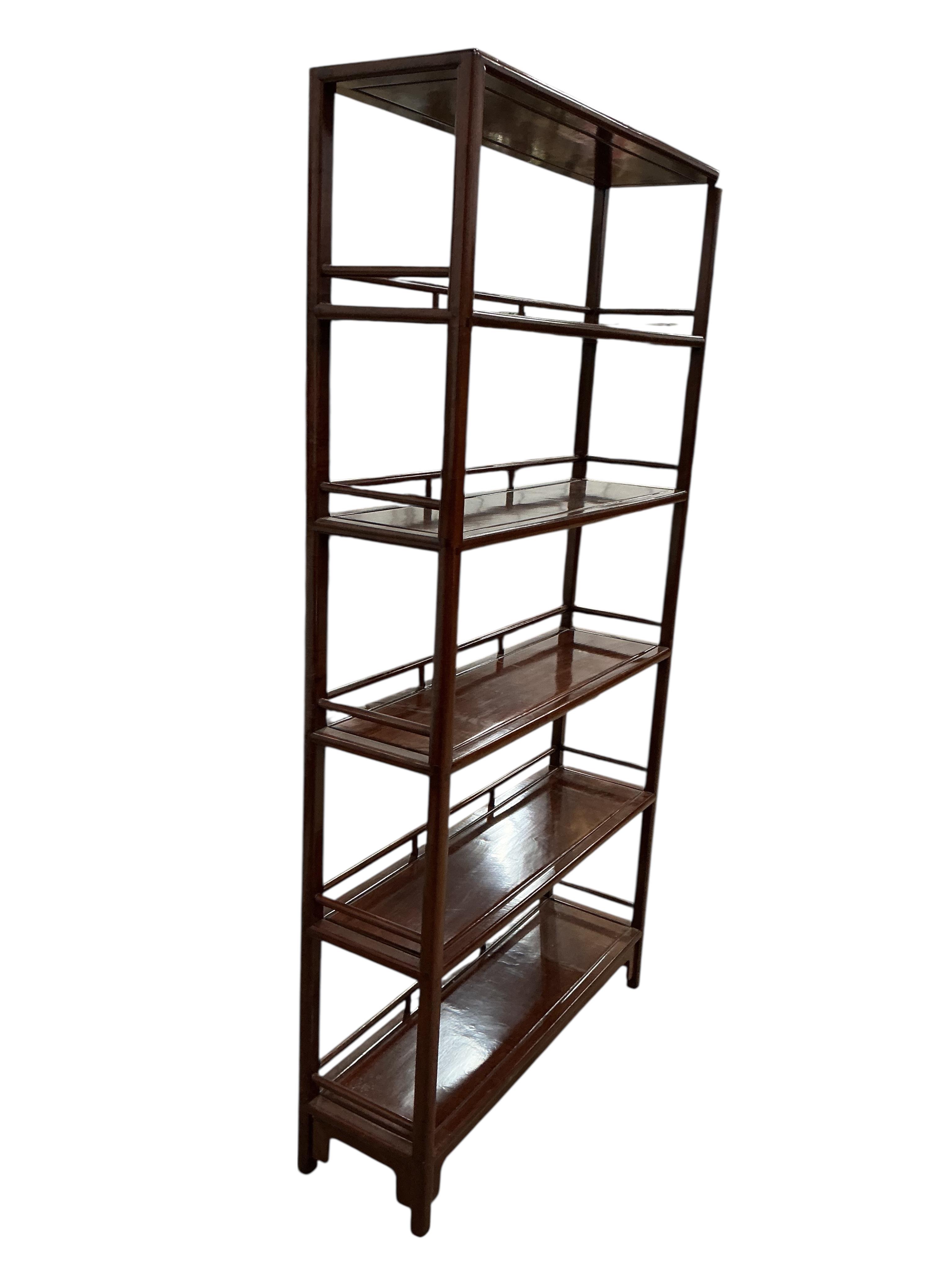 A Chinese hardwood open bookcase, width 100cm, depth 30cm, height 195cm